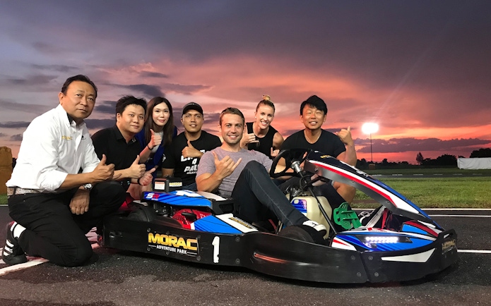Group enjoying go-karting at Morac Adventure Park, Langkawi, during sunset.