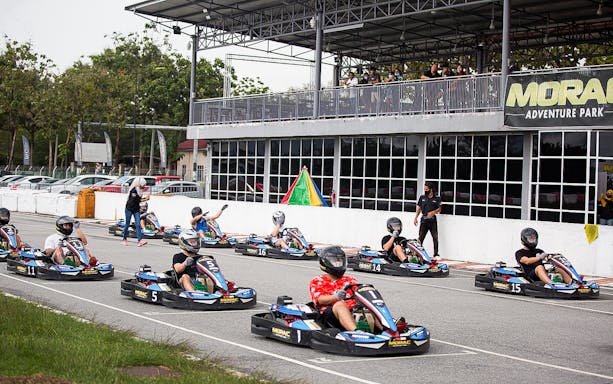 Racers driving go-karts on track at Morac Adventure Park, Langkawi.