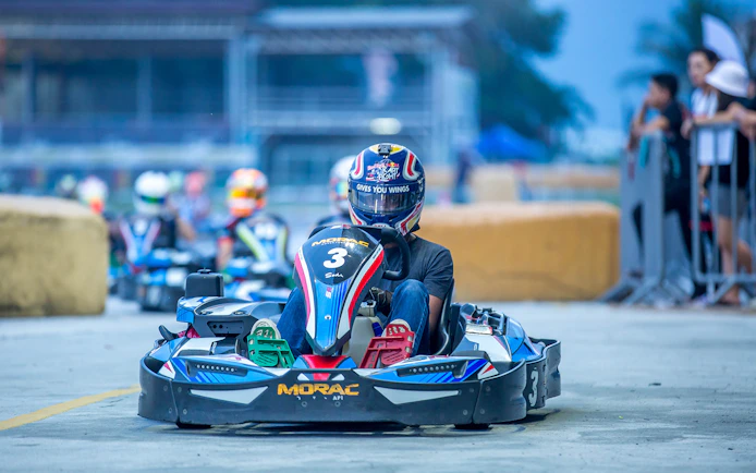 Go-kart racing at Morac Adventure Park, Langkawi, with driver on track.