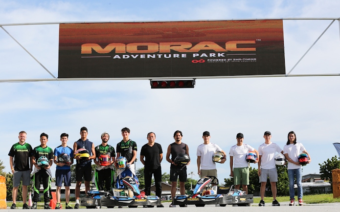 Participants holding helmets at Go-Kart Langkawi, Morac Adventure Park.