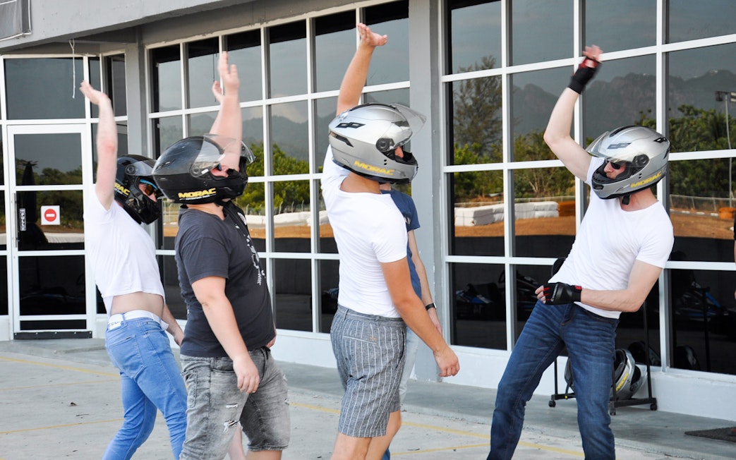 Participants in helmets preparing for a race at Go-Kart Langkawi, Morac Adventure Park.