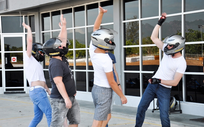 Participants in helmets preparing for a race at Go-Kart Langkawi, Morac Adventure Park.