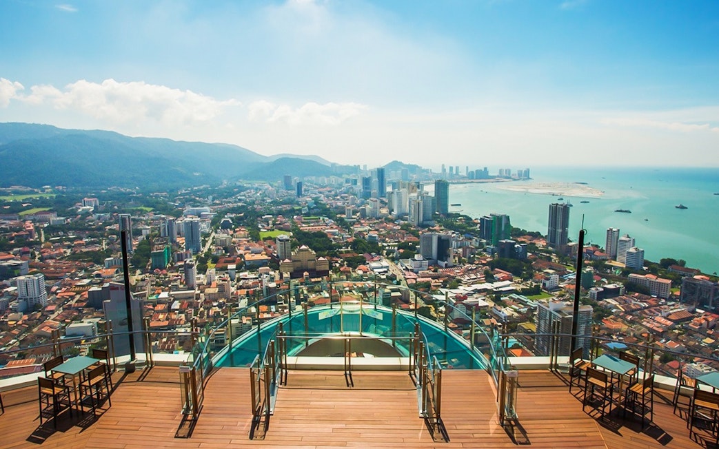 Sky view of Penang cityscape from The Top, overlooking the ocean and urban landscape.