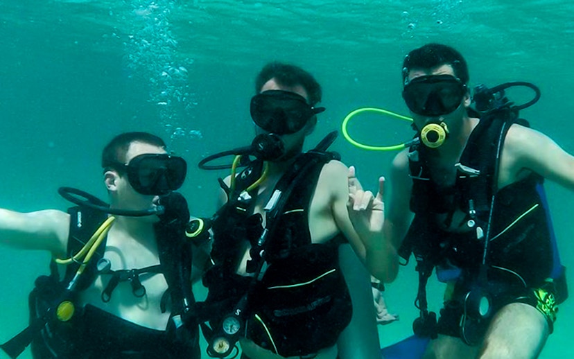 Group scuba diving in Dubai waters.