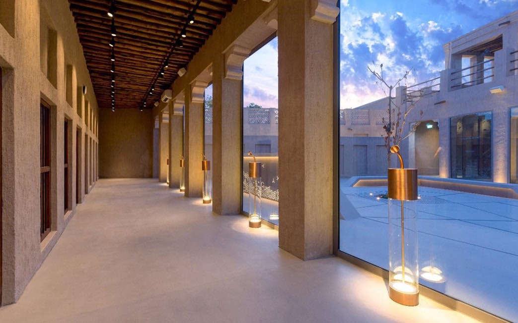 Al Shindagha Museum corridor with modern lighting and large windows.