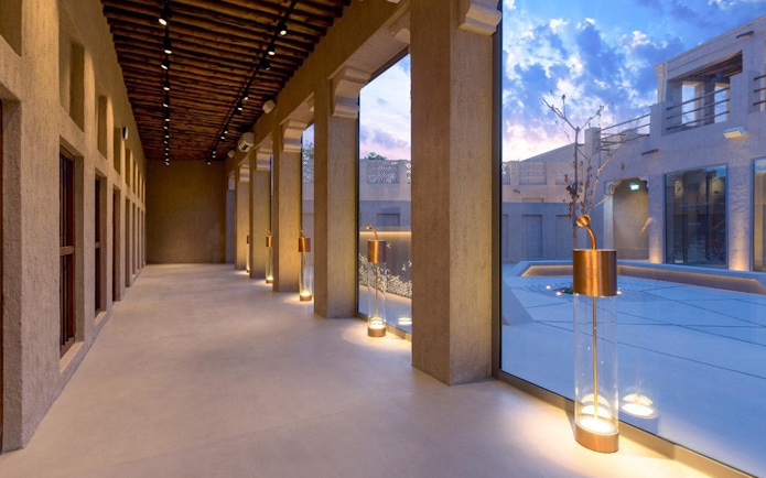 Al Shindagha Museum corridor with modern lighting and large windows.