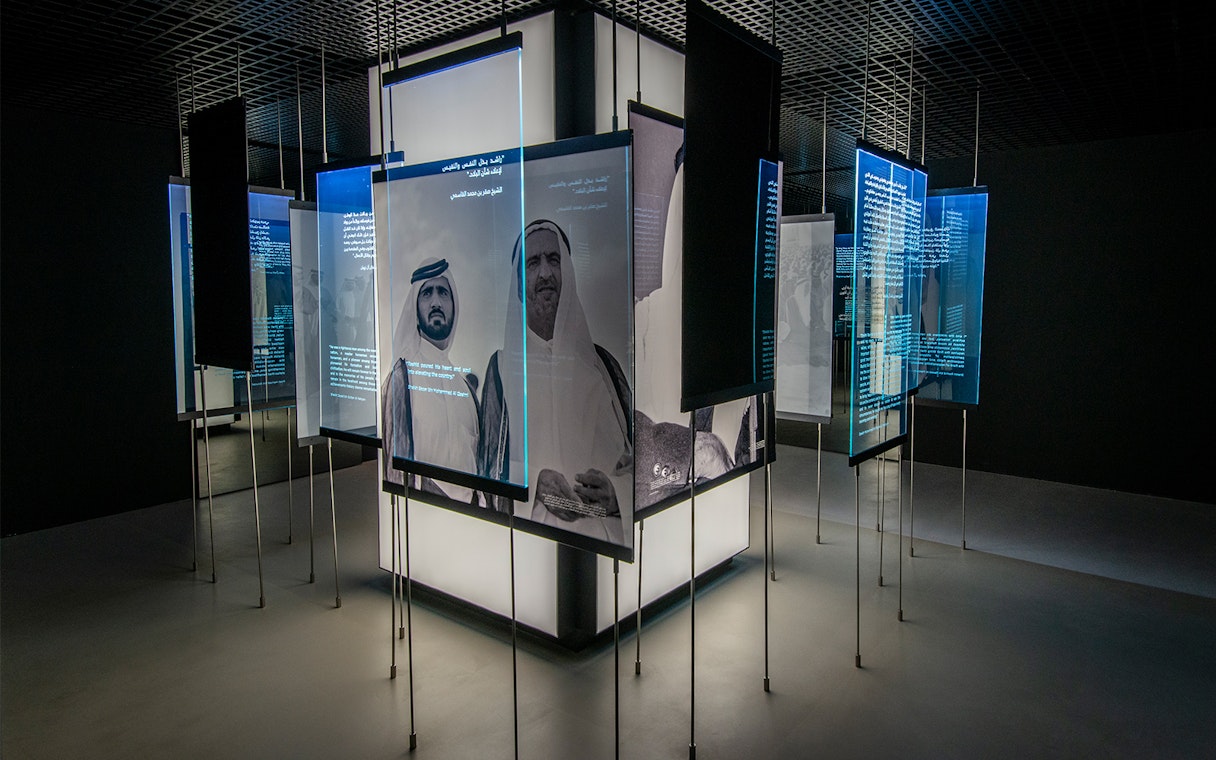 Interactive exhibit with historical figures and text at Al Shindagha Museum, Dubai.