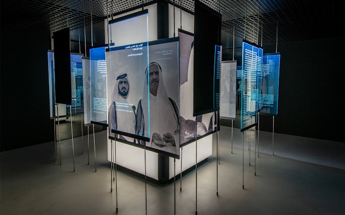 Interactive exhibit with historical figures and text at Al Shindagha Museum, Dubai.