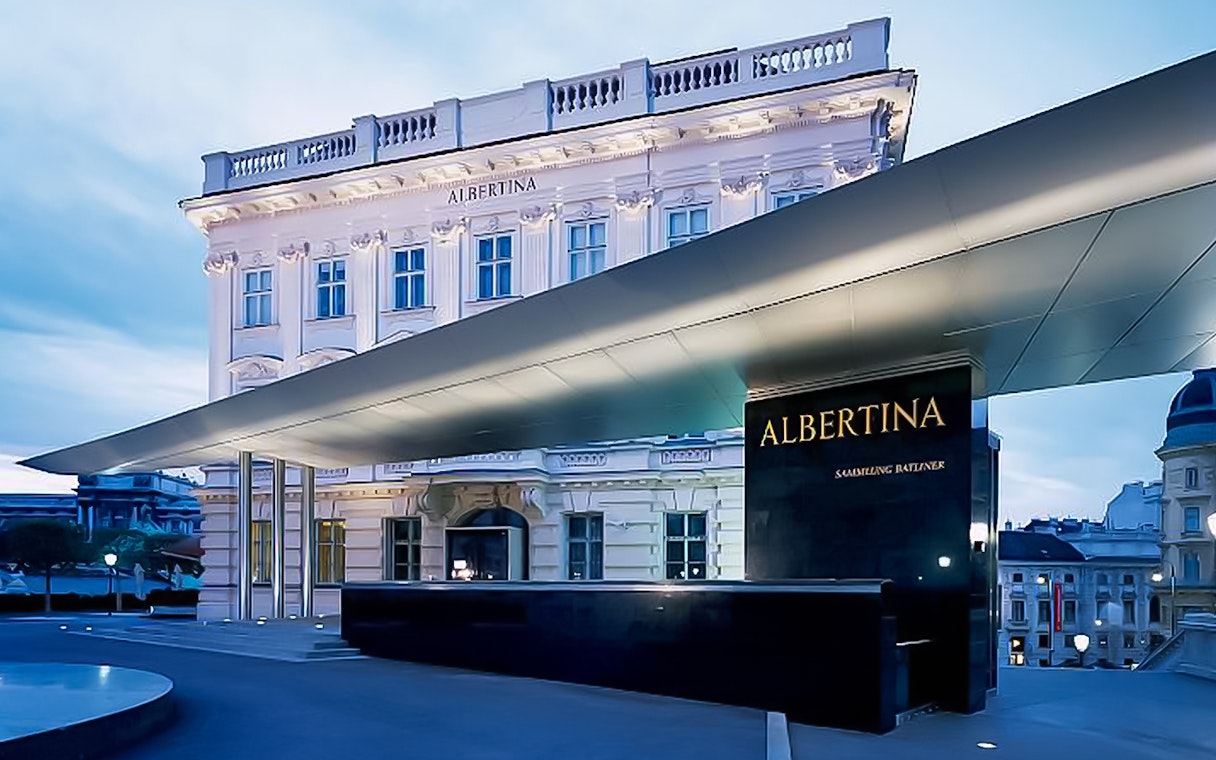 Albertina Museum entrance in Vienna at dusk.
