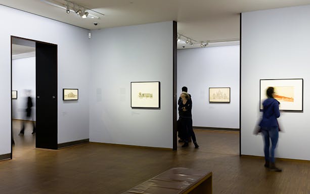 Visitors viewing art in a gallery at Albertina Museum, Vienna.