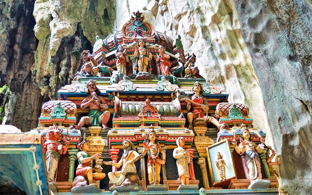 Colorful Hindu temple carvings inside Batu Caves, Malaysia.