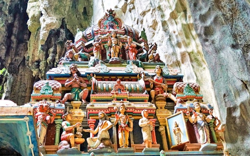 Colorful Hindu temple carvings inside Batu Caves, Malaysia.