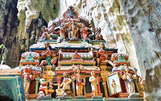 Colorful Hindu temple carvings inside Batu Caves, Malaysia.