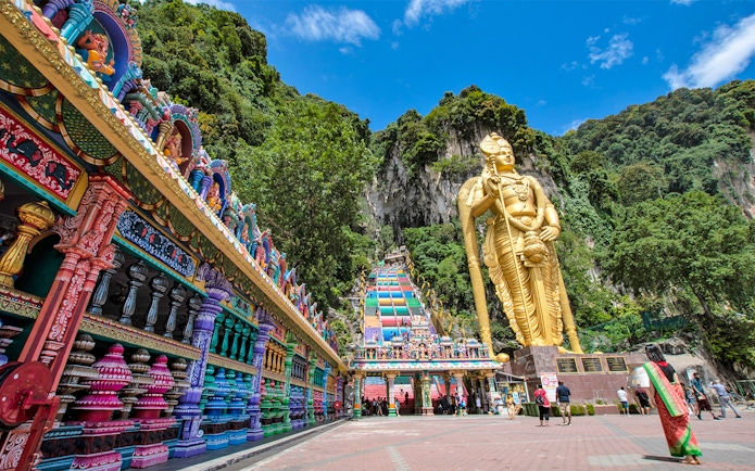 Colorful steps and large statue at Batu Caves, Malaysia, part of Colmar Tropicale day tour.