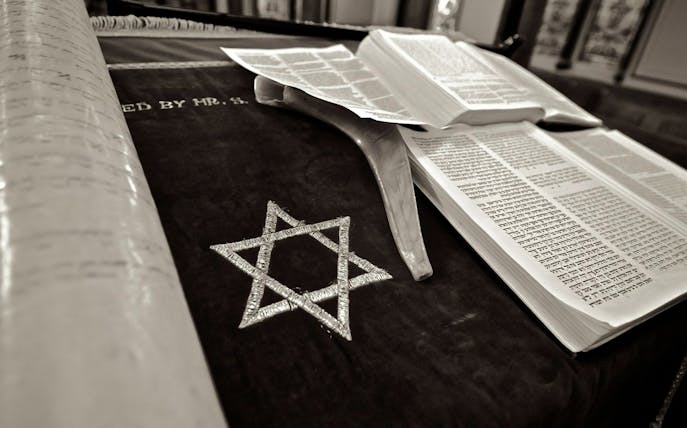 Open Torah scroll and shofar on a table at Kazinczy Synagogue, Budapest.