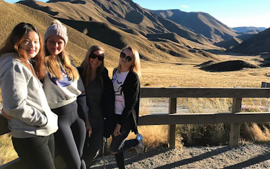 Group of tourists enjoying the view of Mt Cook and Lake Tekapo landscape.