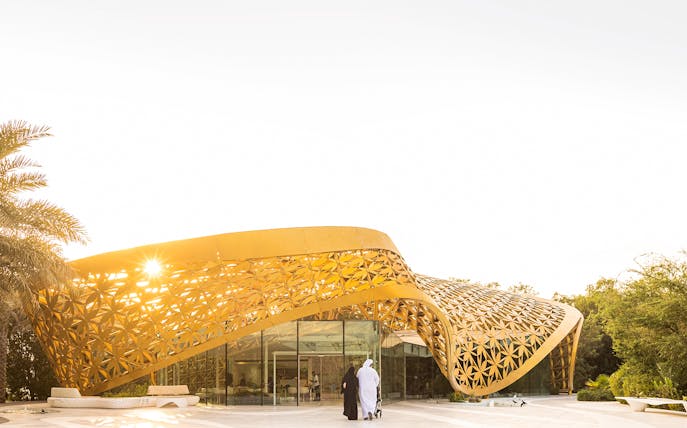 Al Noor Island entrance with golden architectural design in Sharjah.