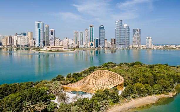Al Noor Island with Sharjah skyline and Butterfly House in view.