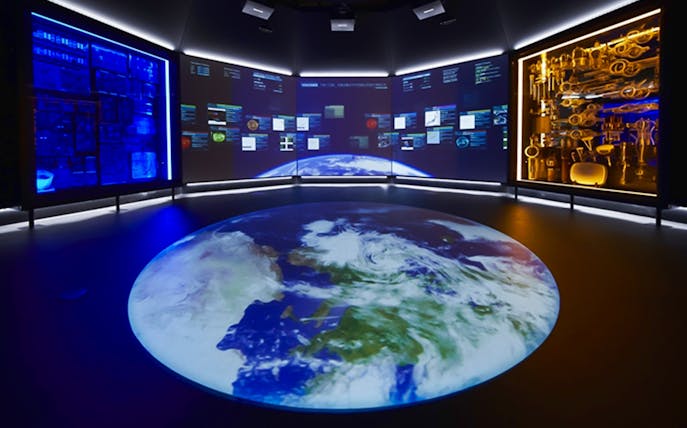 Interactive exhibit at National Museum of Nature and Science, Tokyo, featuring Earth projection and digital displays.
