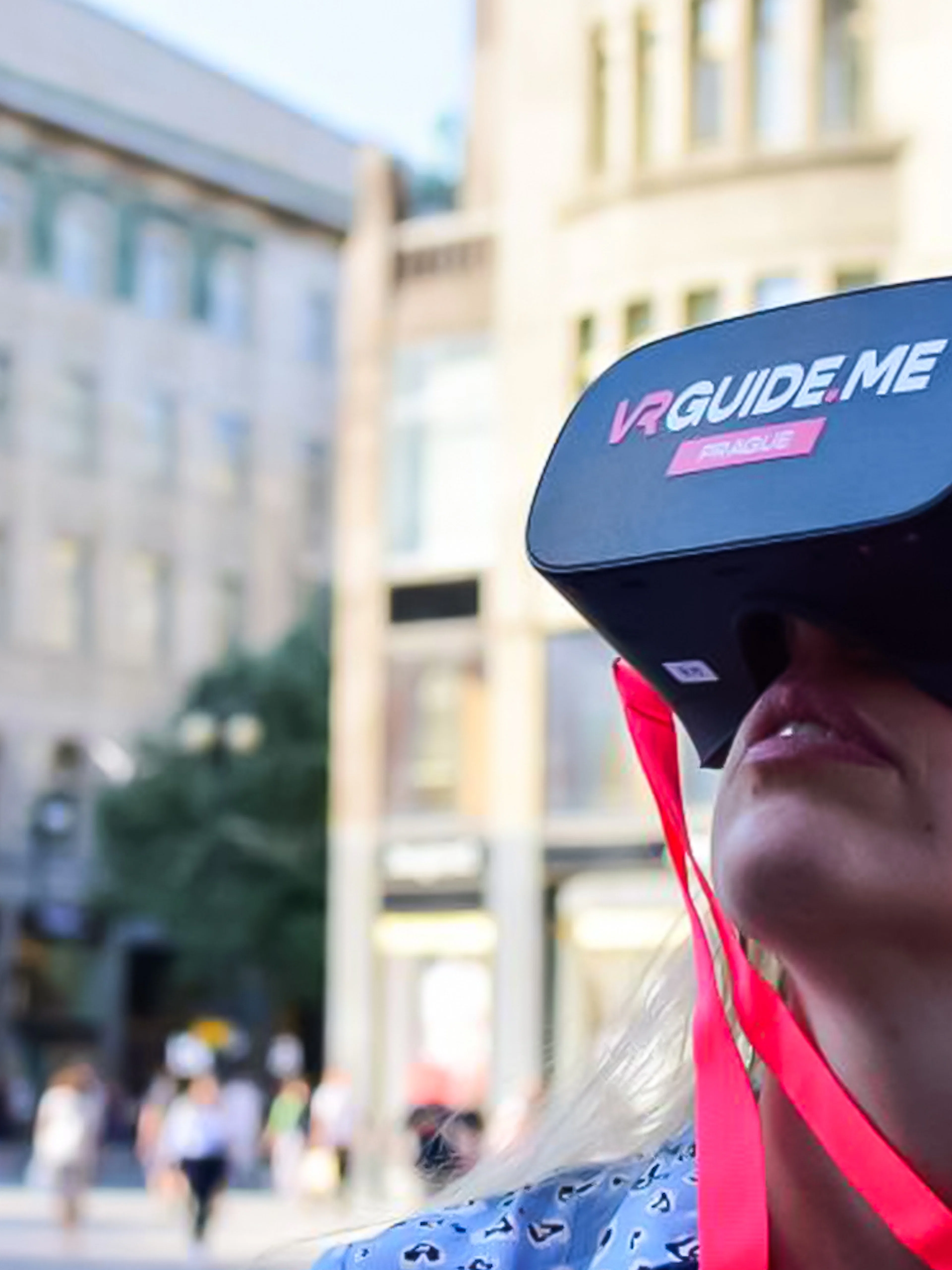 Person using VR headset on Charles Bridge tour in Prague.