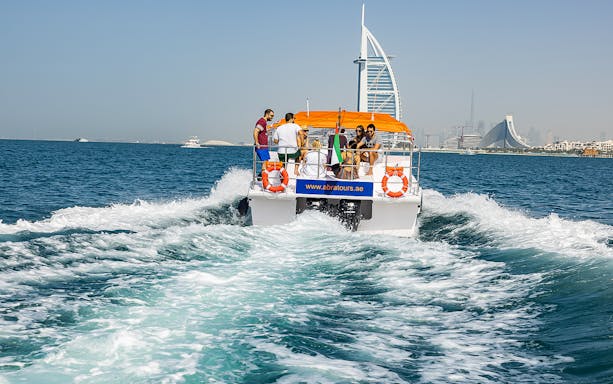 Private small group on a boat cruise with Burj Al Arab in Dubai.