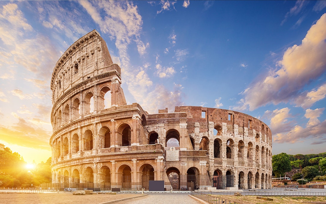 Colosseum in Rome at sunset, part of Roma Pass and Lateran Complex tour.