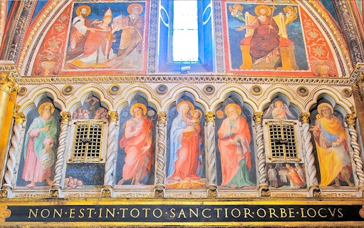 Frescoes in the Lateran Complex, Rome, depicting religious figures and Latin inscriptions.