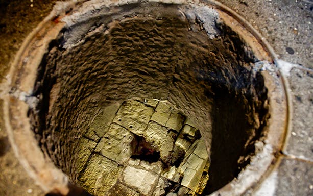 Ancient stone well at Carcer Tullianum, Rome, part of the Roma Pass tour.