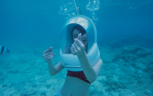 Underwater helmet diving at Okinawa Marine Park.