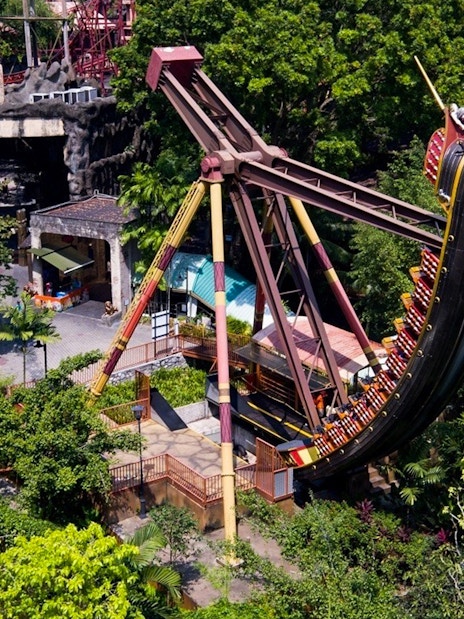 Sunway Lagoon amusement park ride surrounded by lush greenery.