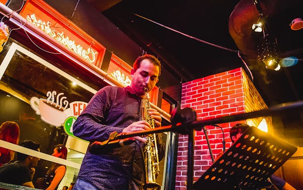 Musician playing saxophone at Central Perk Singapore.