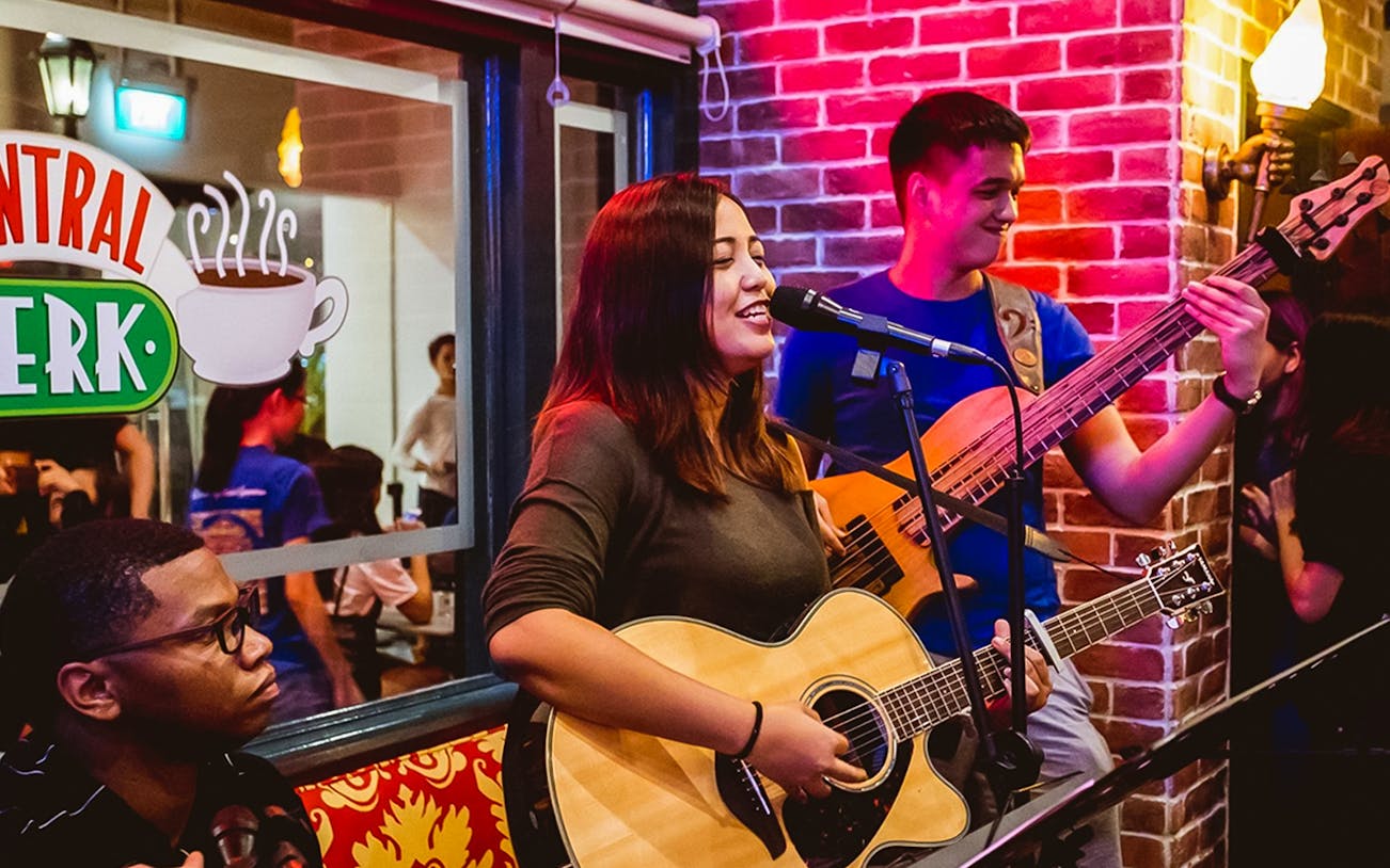 Musicians performing live at Central Perk Singapore.