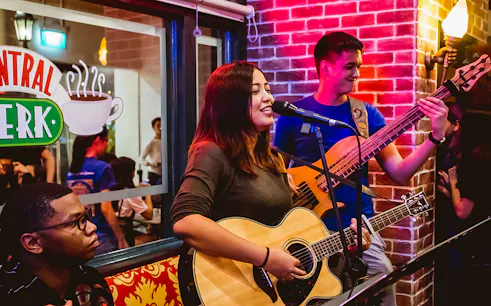 Musicians performing live at Central Perk Singapore.