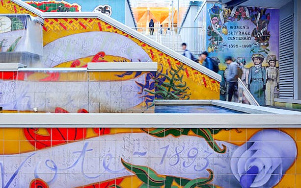 Auckland mural celebrating women's suffrage centenary on a guided walking tour.