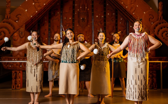 Performers in traditional Māori attire at Auckland War Memorial Museum.