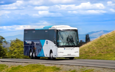 Tour bus traveling to Hobbiton Movie Set from Rotorua, New Zealand.