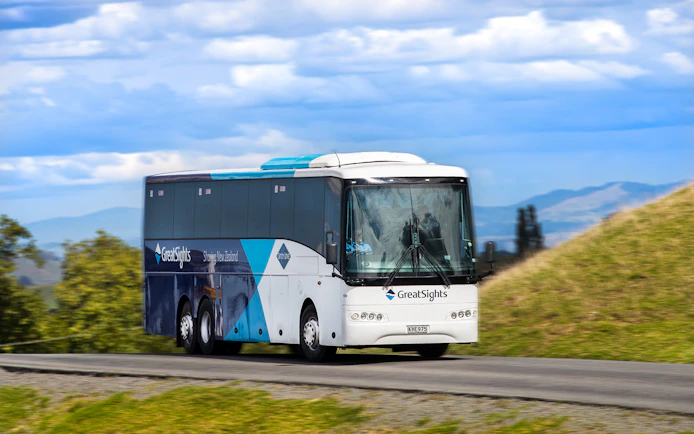Tour bus traveling to Hobbiton Movie Set from Rotorua, New Zealand.