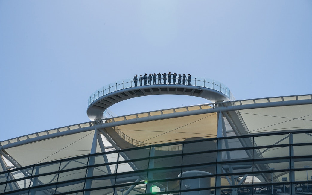 Visitors on rooftop walkway at Optus Stadium, Perth, during stadium tour.