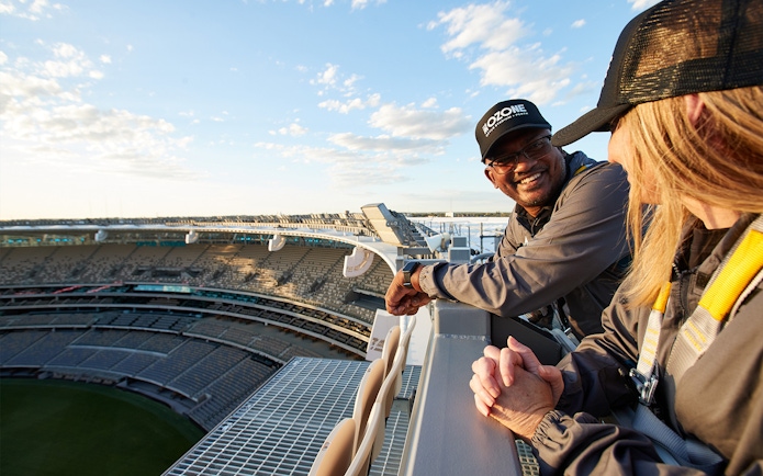 Visitors enjoying the view from the top of Optus Stadium during a guided tour in Perth.