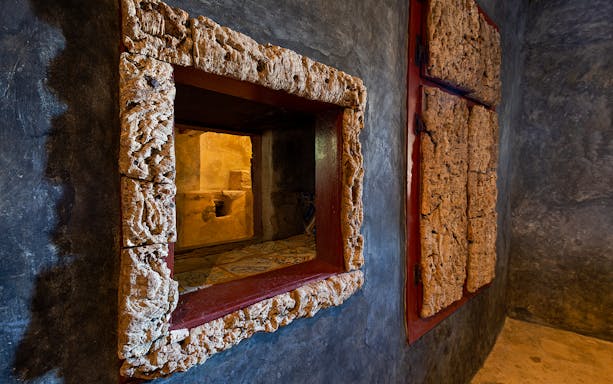 Convento dos Capuchos interior with rustic stone window frame, Sintra, Portugal.