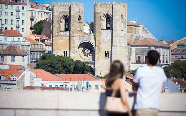 Lisbon Cathedral viewed from a distance during a guided walking tour.