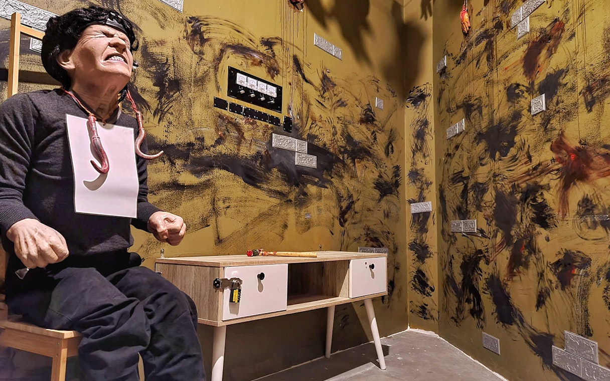 Escape room scene with mannequin and desk, Trapped Escape Room, Singapore.