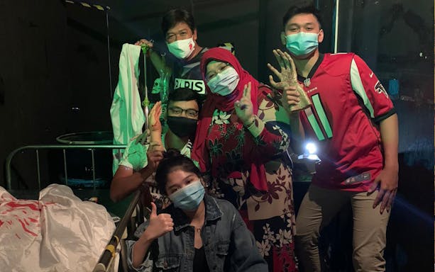 Group enjoying Trapped Escape Room experience in Singapore.