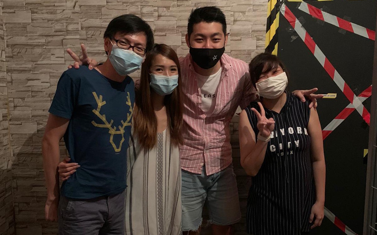 Group of people posing at Trapped Escape Room in Singapore.