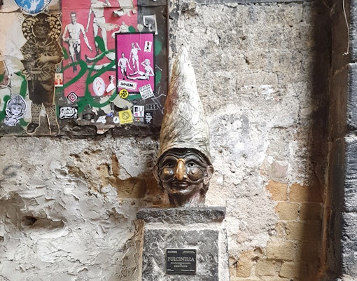Naples Underground tour showcasing ancient ruins and artifacts from Piazza San Gaetano.