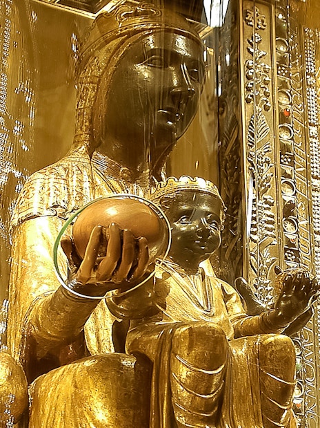 Statue of Madonna Von Montserrat holding an orb inside Montserrat Monastery.