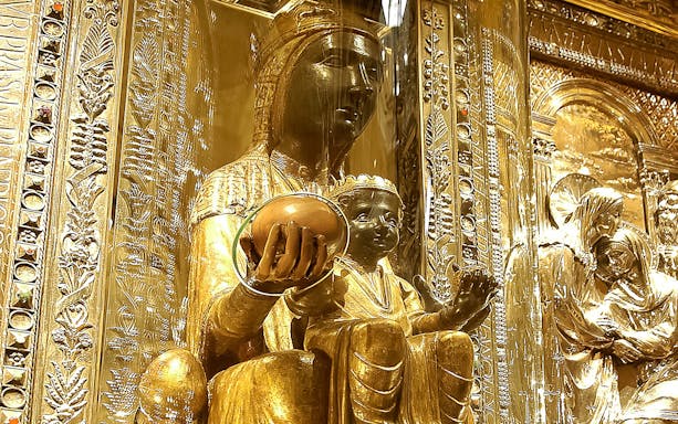 Statue of Madonna Von Montserrat holding an orb inside Montserrat Monastery.