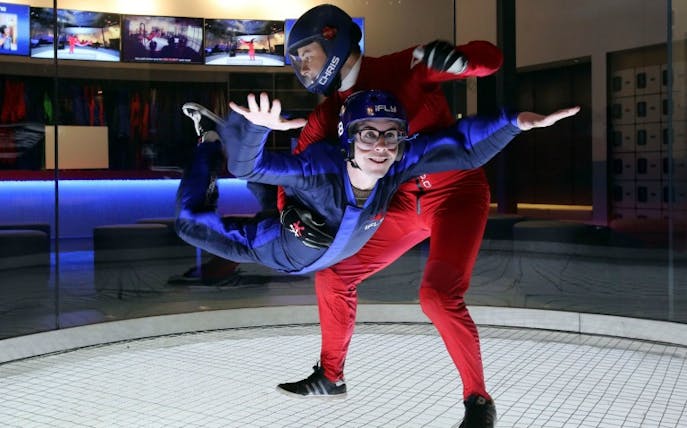 Indoor skydiving experience with instructor at iFLY facility.