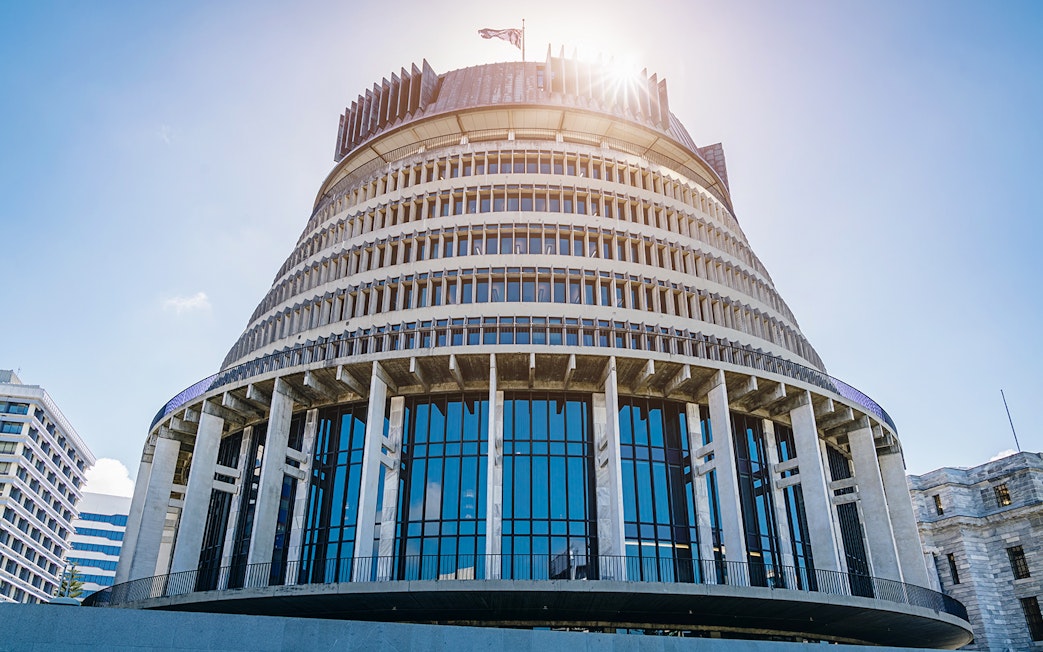 Wellington's Beehive building under a clear sky on a guided tour.