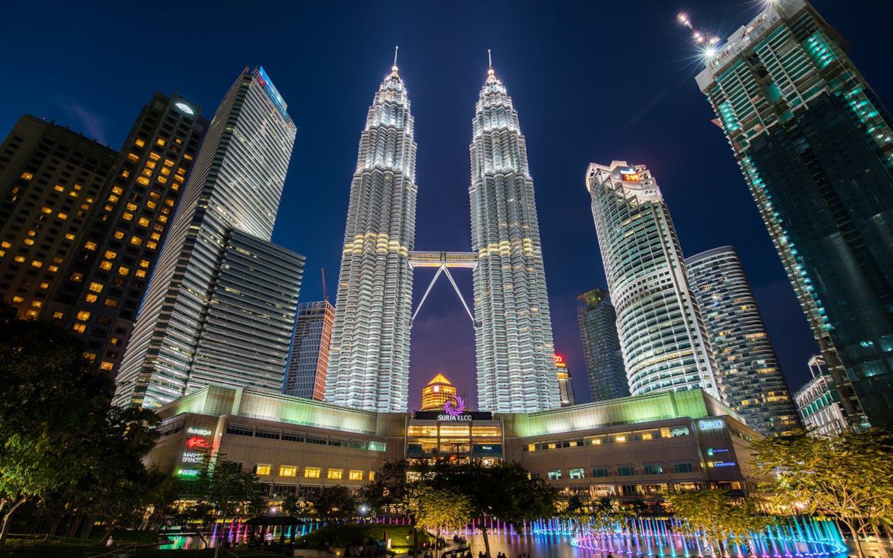 Petronas Twin Towers illuminated at night in Kuala Lumpur, Malaysia.
